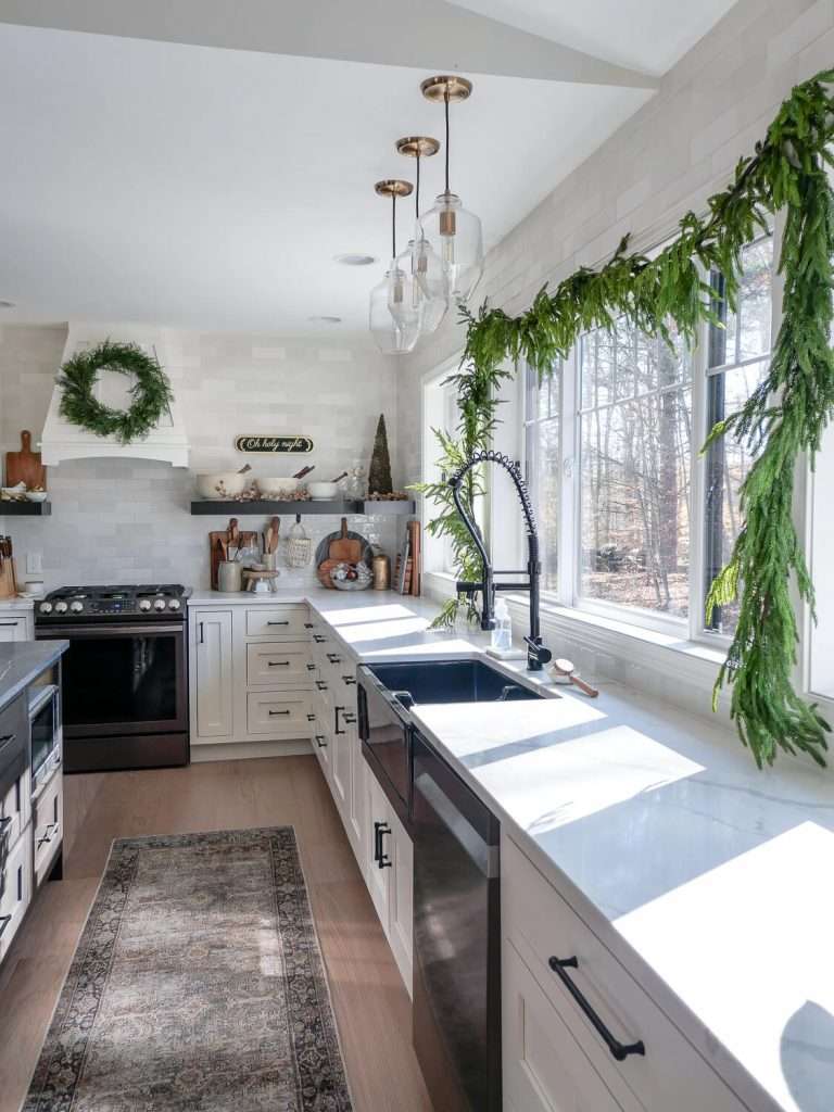 Kitchen island Christmas centerpiece ideas in a modern farmhouse kitchen.