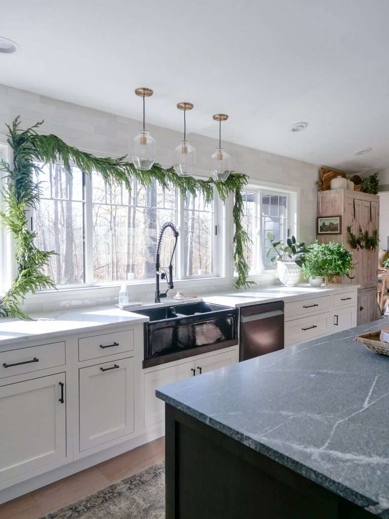 Christmas garland over a kitchen window.