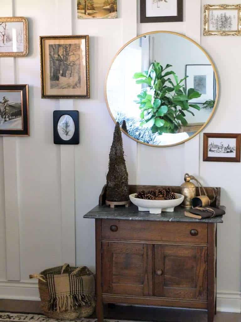 Vintage gallery wall with a mirror.