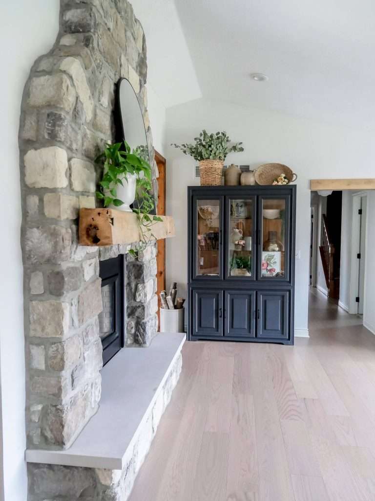Stone fireplace in a living room.