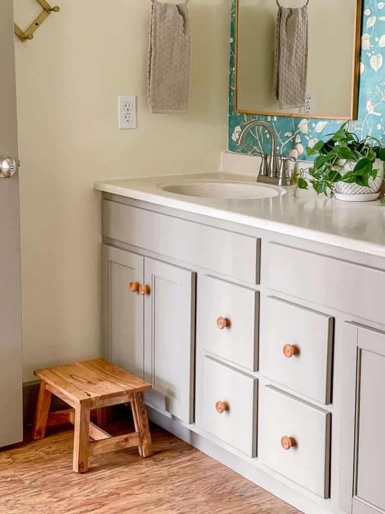 Wood knobs on a bathroom vanity.