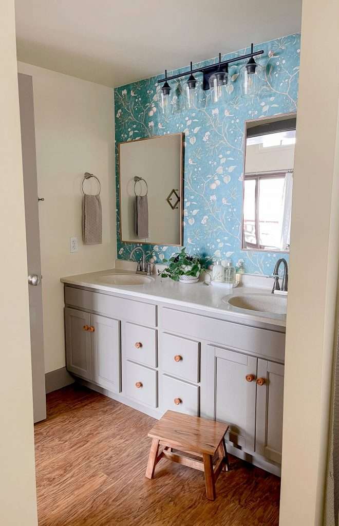 Double vanity with wood knobs.