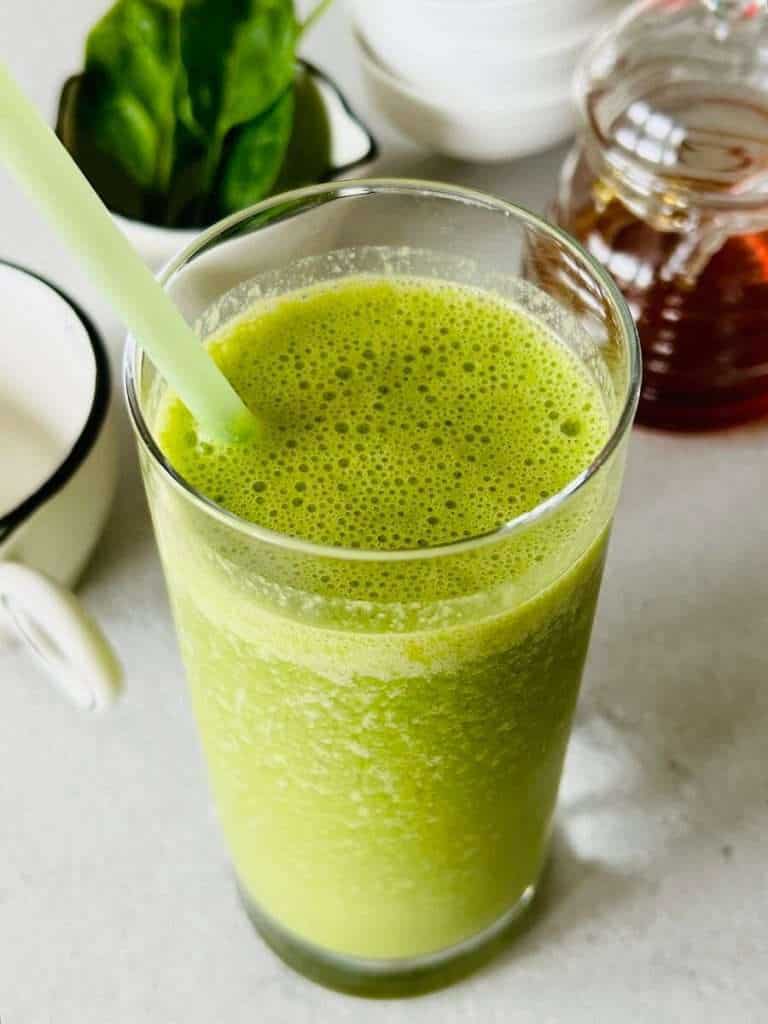 Green passion smoothie in a glass.