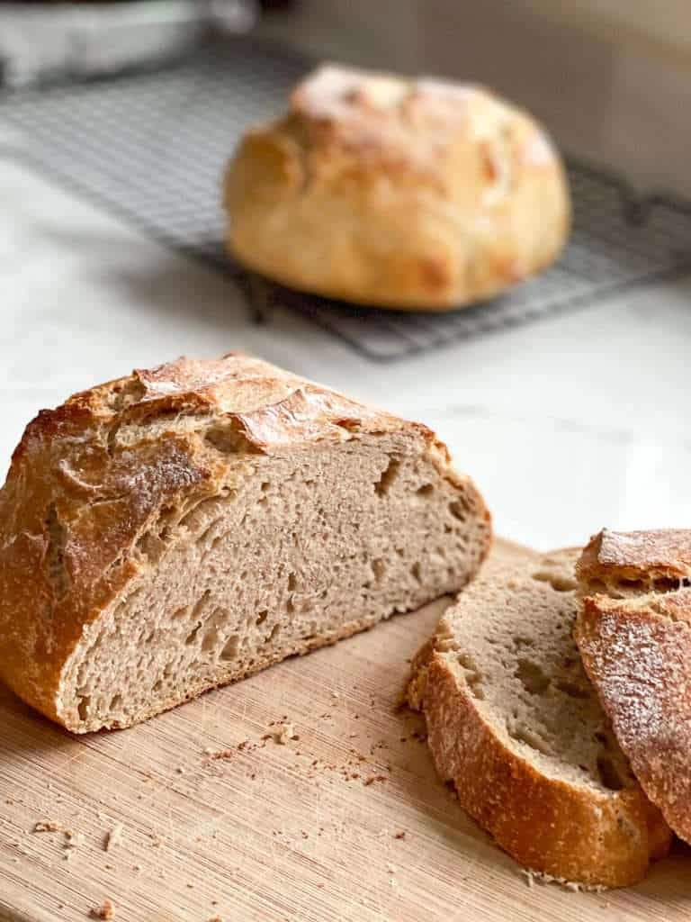 No Knead Whole Wheat Sourdough Bread on a countertop