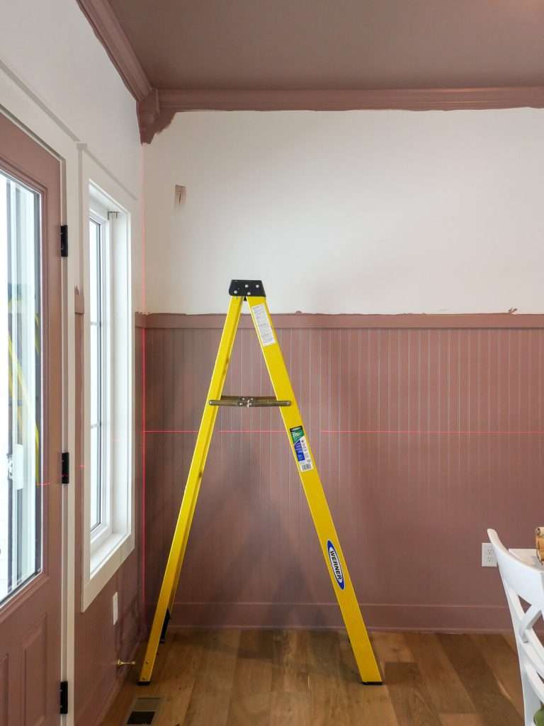 Laser level for how to install self-adhesive wallpaper.