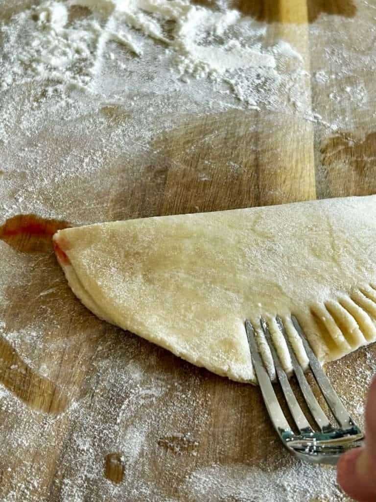 Fork to crimp edges of dough.