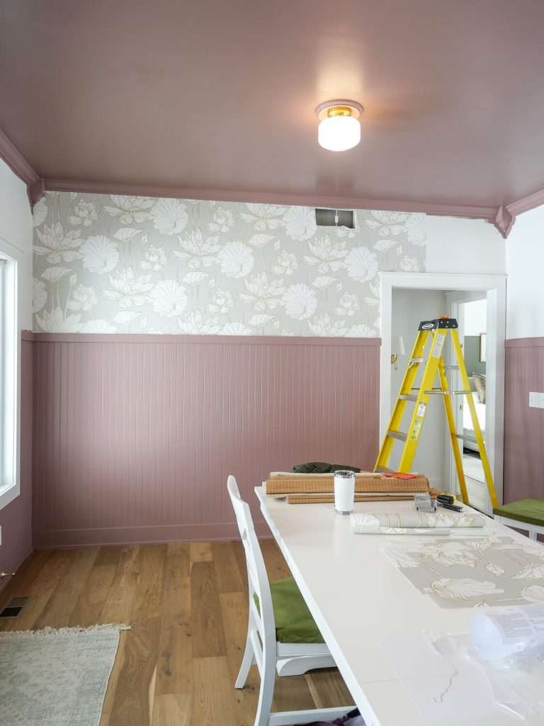 Adding wallpaper around a dining room.