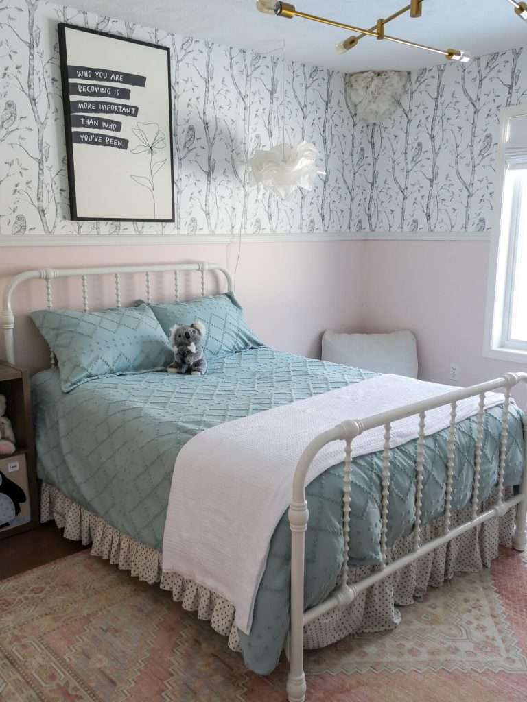 Girl's bedroom with textured comforter.