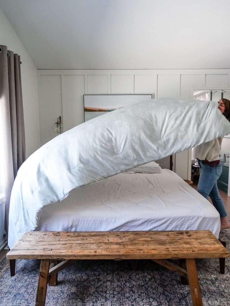 Woman making a bed