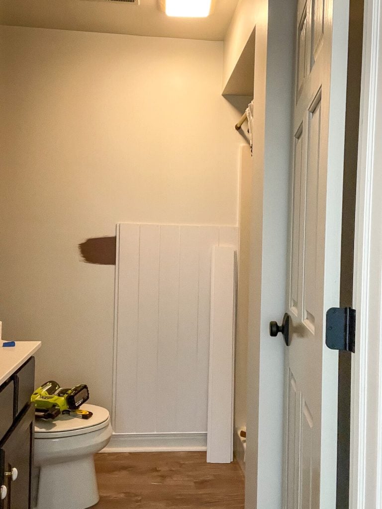 Installing shiplap in a windowless bathroom.