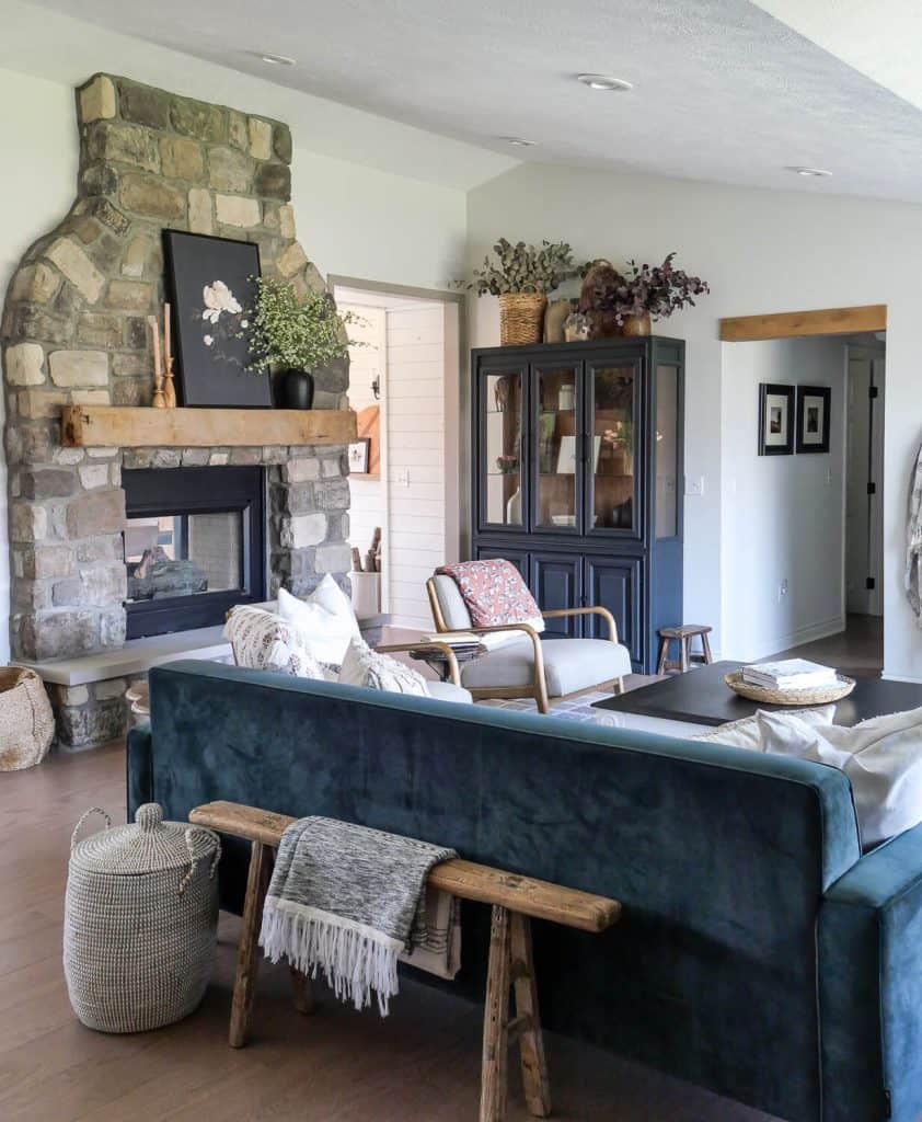 Timeless interior design in a living room with stone fireplace.