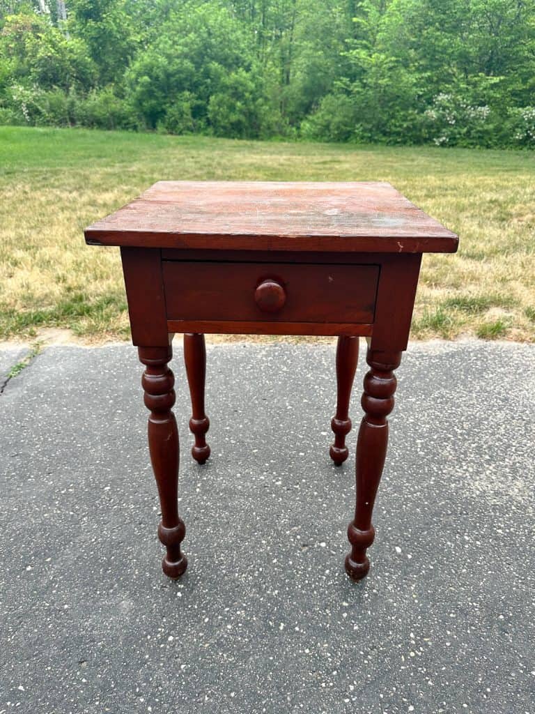 Wood table before using oven cleaner to strip wood.