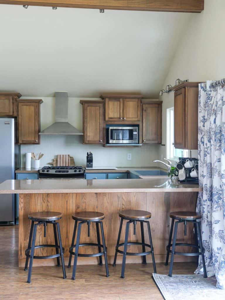 Wood kitchen cabinets with blue accents.