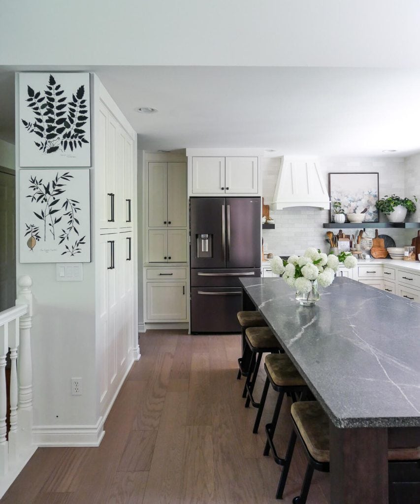 Dark Kitchen island in a white kitchen.