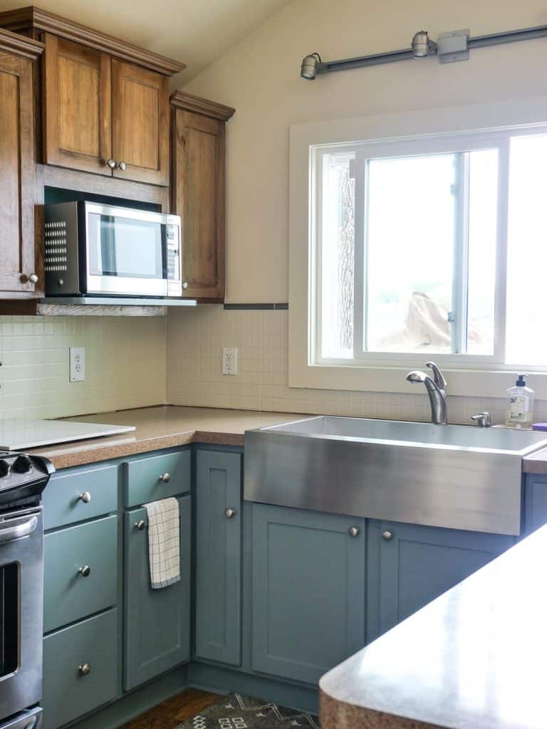 Cottage kitchen with blue painted cabinets.