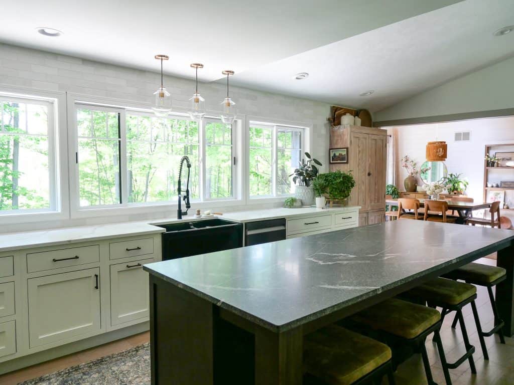 Open kitchen with a large island and granite countertop.