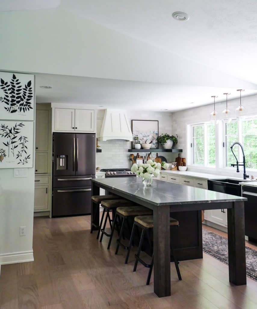 Large kitchen island in a white kitchen.