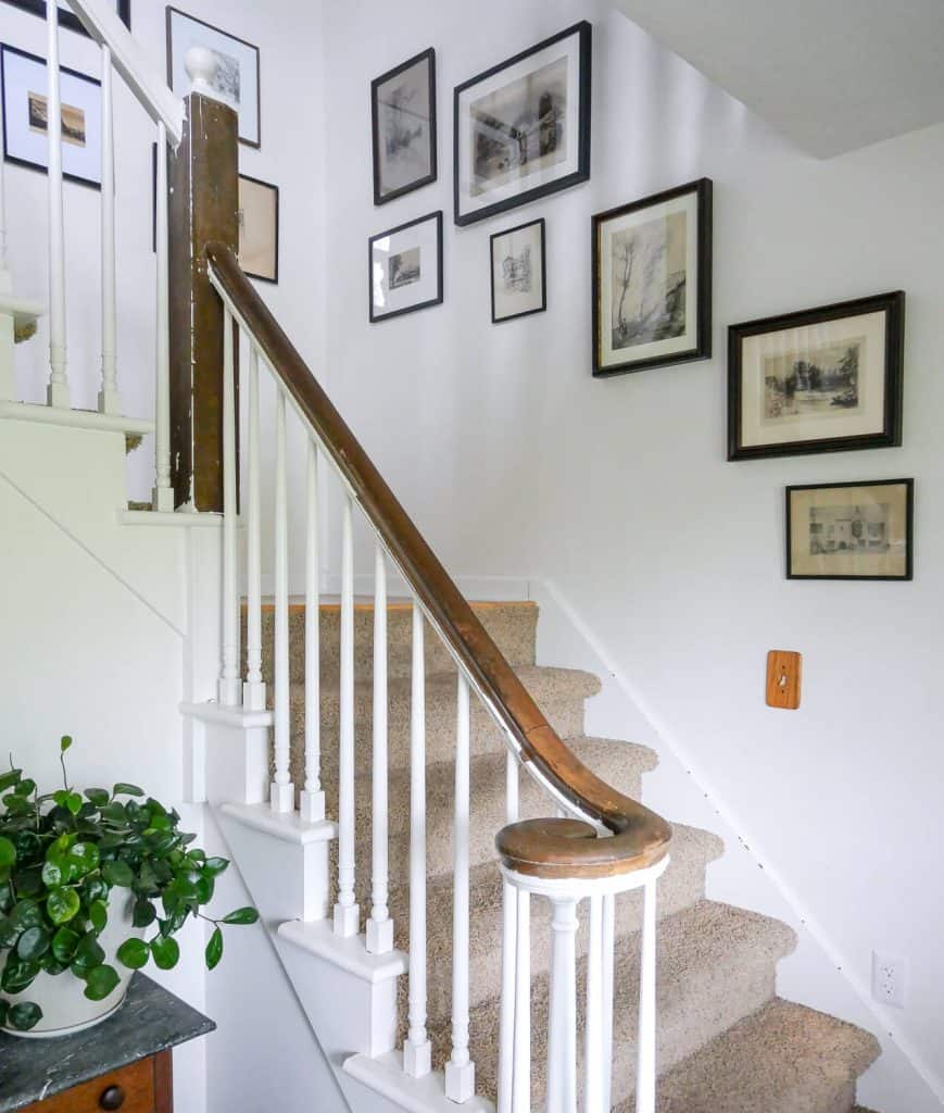 Staircase with vintage artwork.