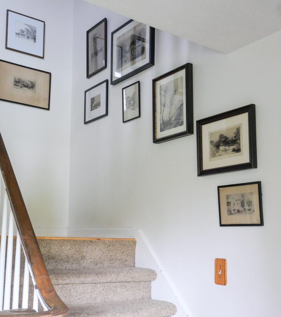 Vintage gallery wall in a stairwell.