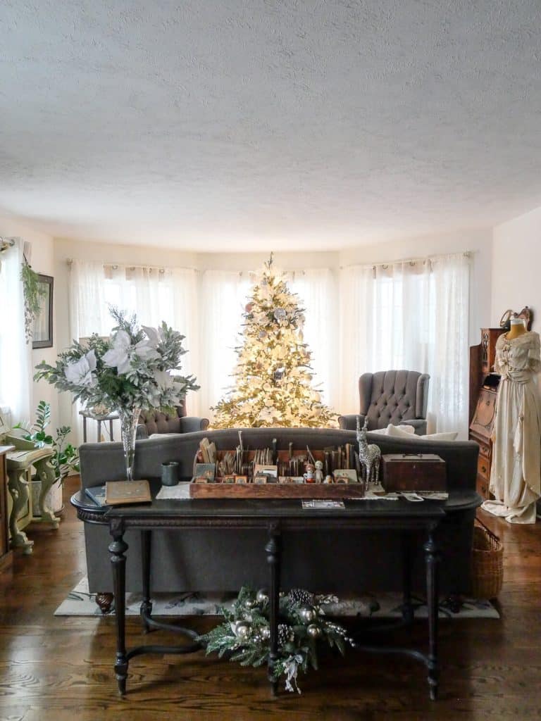 Antique furniture with Christmas tree in the background.