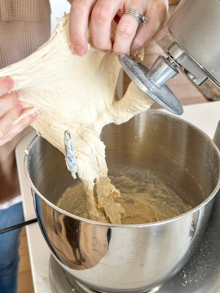 Bread dough being stretched.