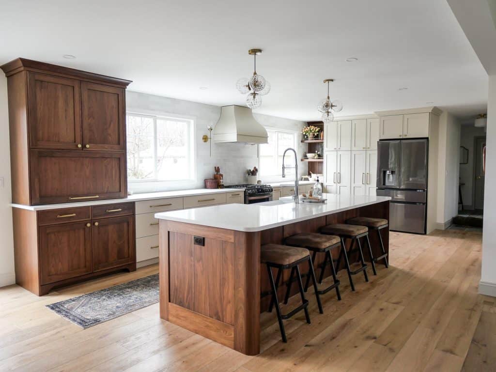 Walnut kitchen island with full overlay cabinet style.