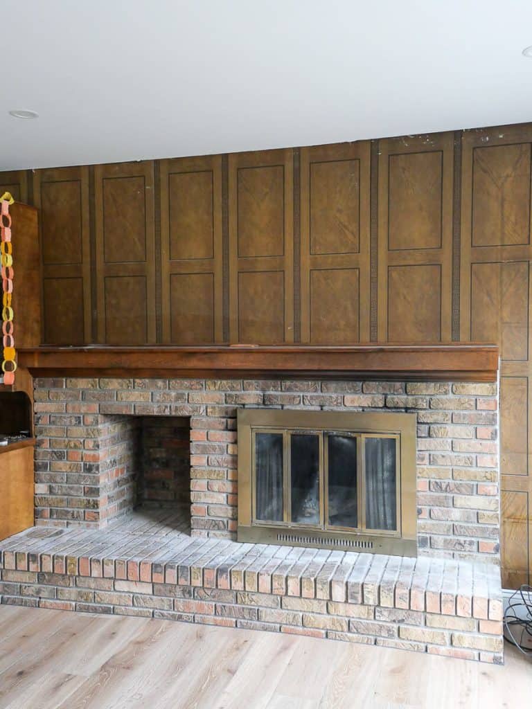 Brick fireplace before painting.