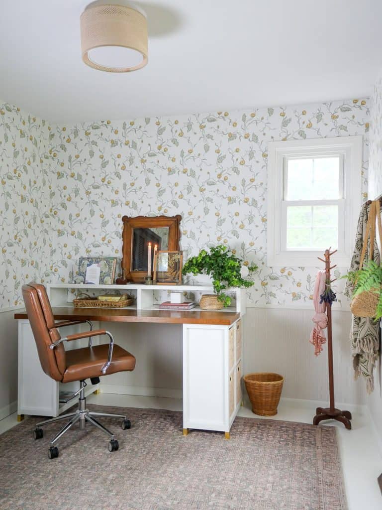 Office with cottage core wallpaper.