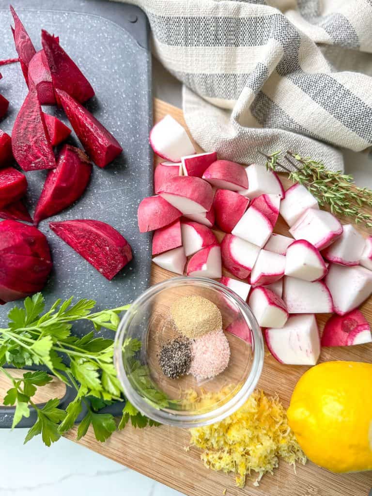 Flat lay of chopped root vegetables and spices.