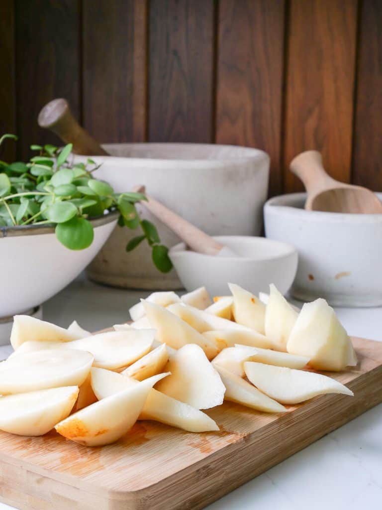 Sliced pears on a cutting board.