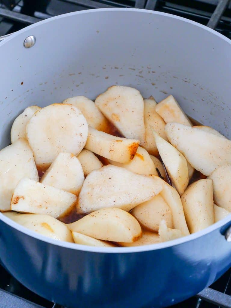 Sliced pears in a pot.