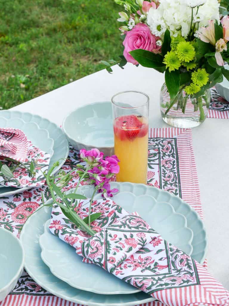 Cloth napkins folded on a garden party table setting.