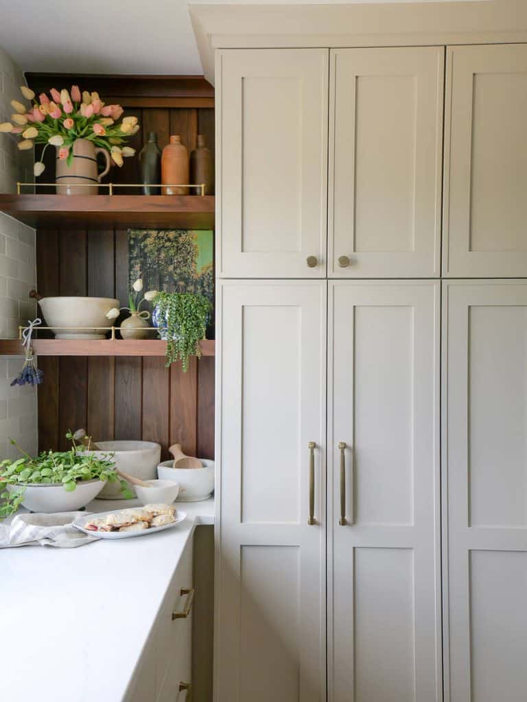 Kitchen cabinets with styled shelves.