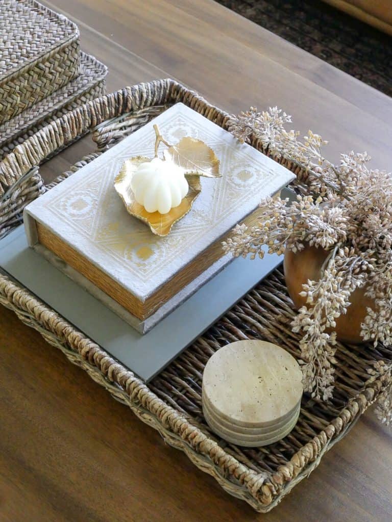 Coffee table styled with a tray of decor.