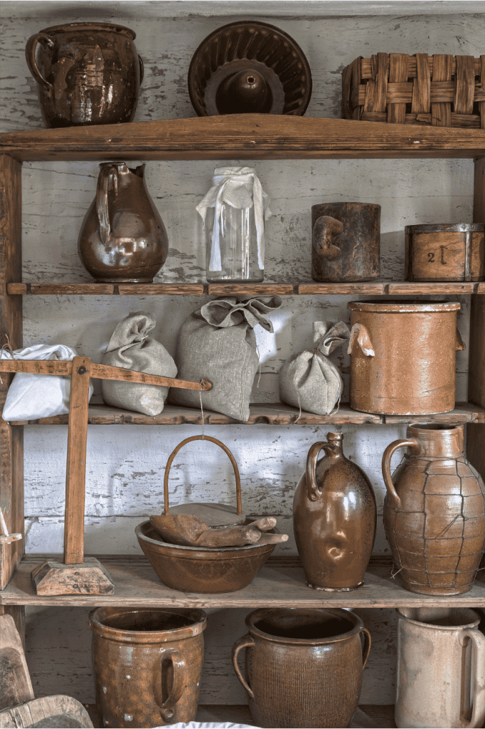 Favorite antiques on kitchen shelves.