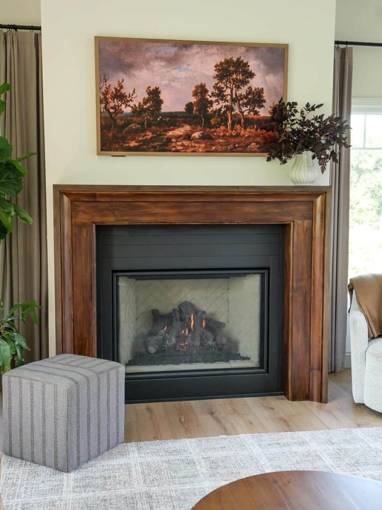 Fall leaves on a living room mantel decorated for fall.
