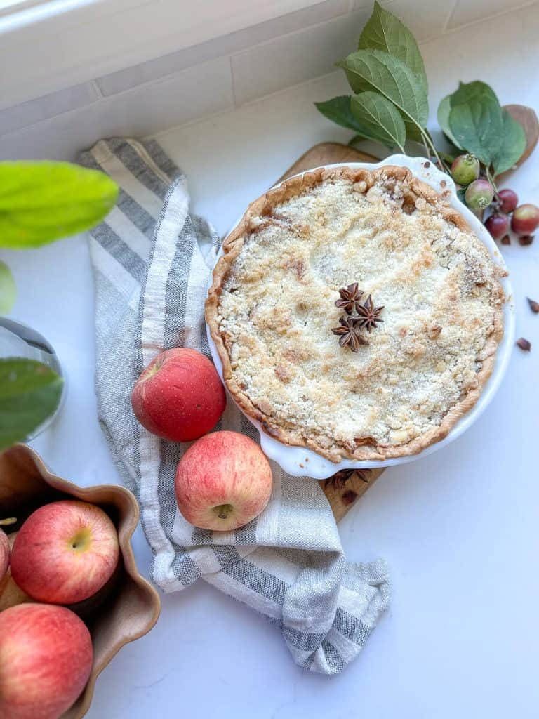 Apple pie styled on a countertop.