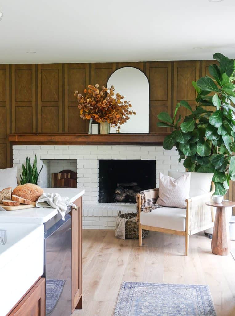 Fireplace with fall foliage bouquet.