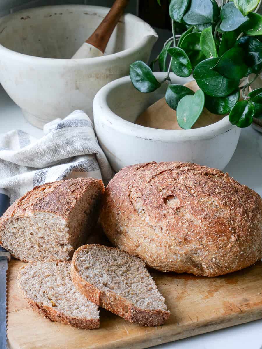 Multigrain sourdough bread sliced on a counter.