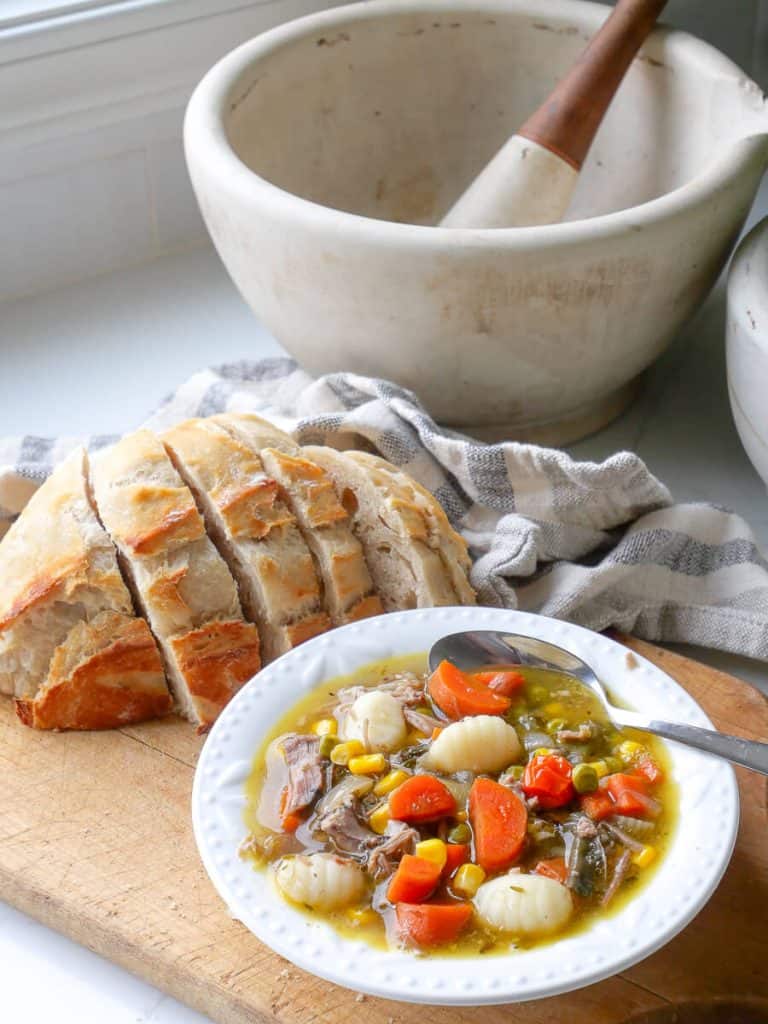 Bowl of soup on a countertop.