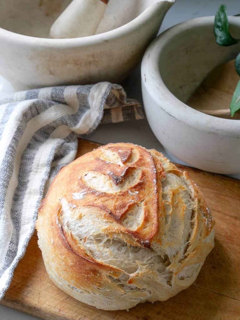 Loaf of bread on a cutting board.