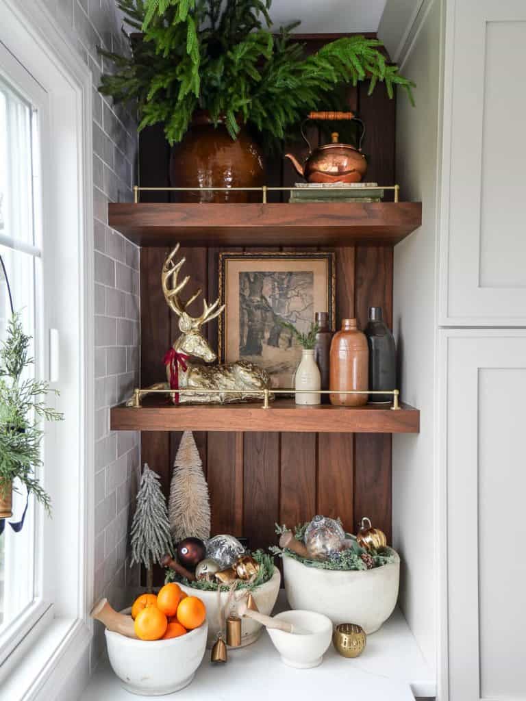 Norfolk pine branches on kitchen shelves.