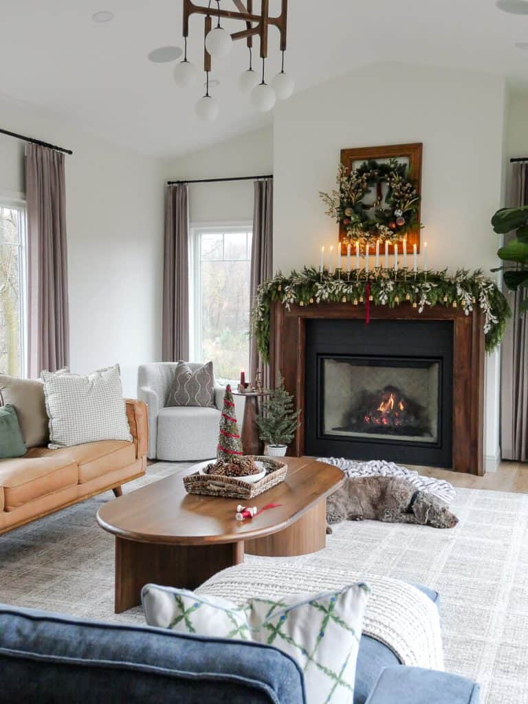 Moss tree on a coffee table with Christmas mantel.