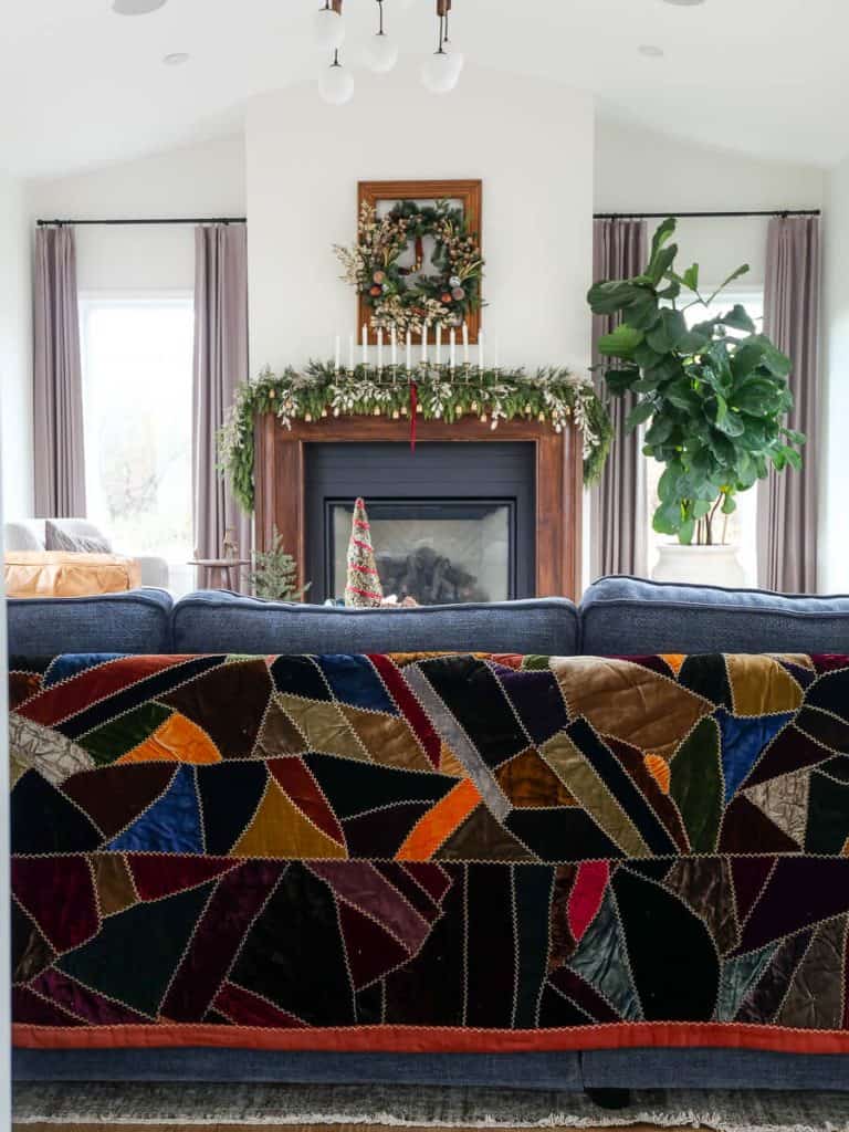 Antique crazy quilt on a sofa.