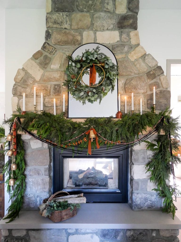 Christmas fireplace mantel with candles.