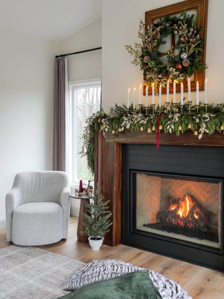 DIY Christmas wreath over a fireplace mantel.