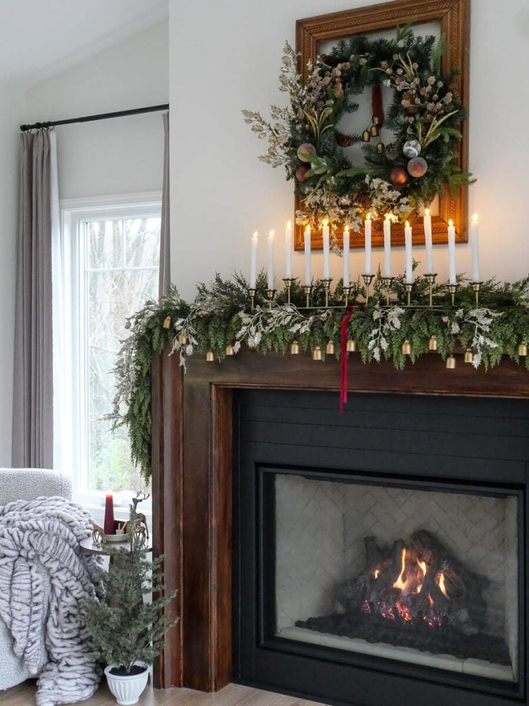 Up close of a simple fireplace Christmas mantel.