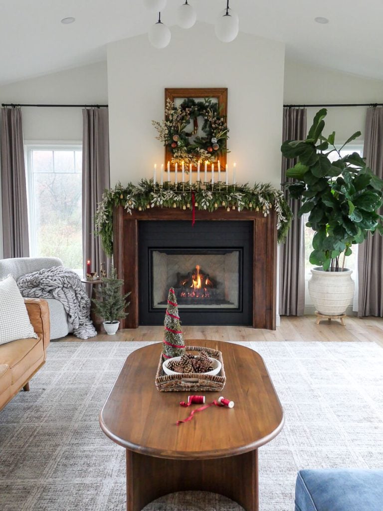 Simple christmas mantel decor in a living room.