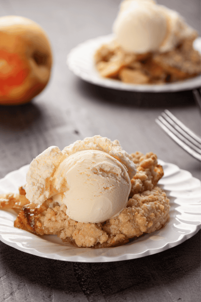 Apple Crisp topped with ice cream.