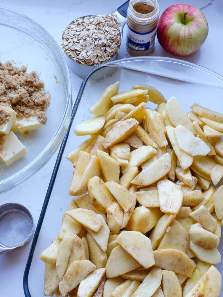 Cinnamon apples in a baking dish.